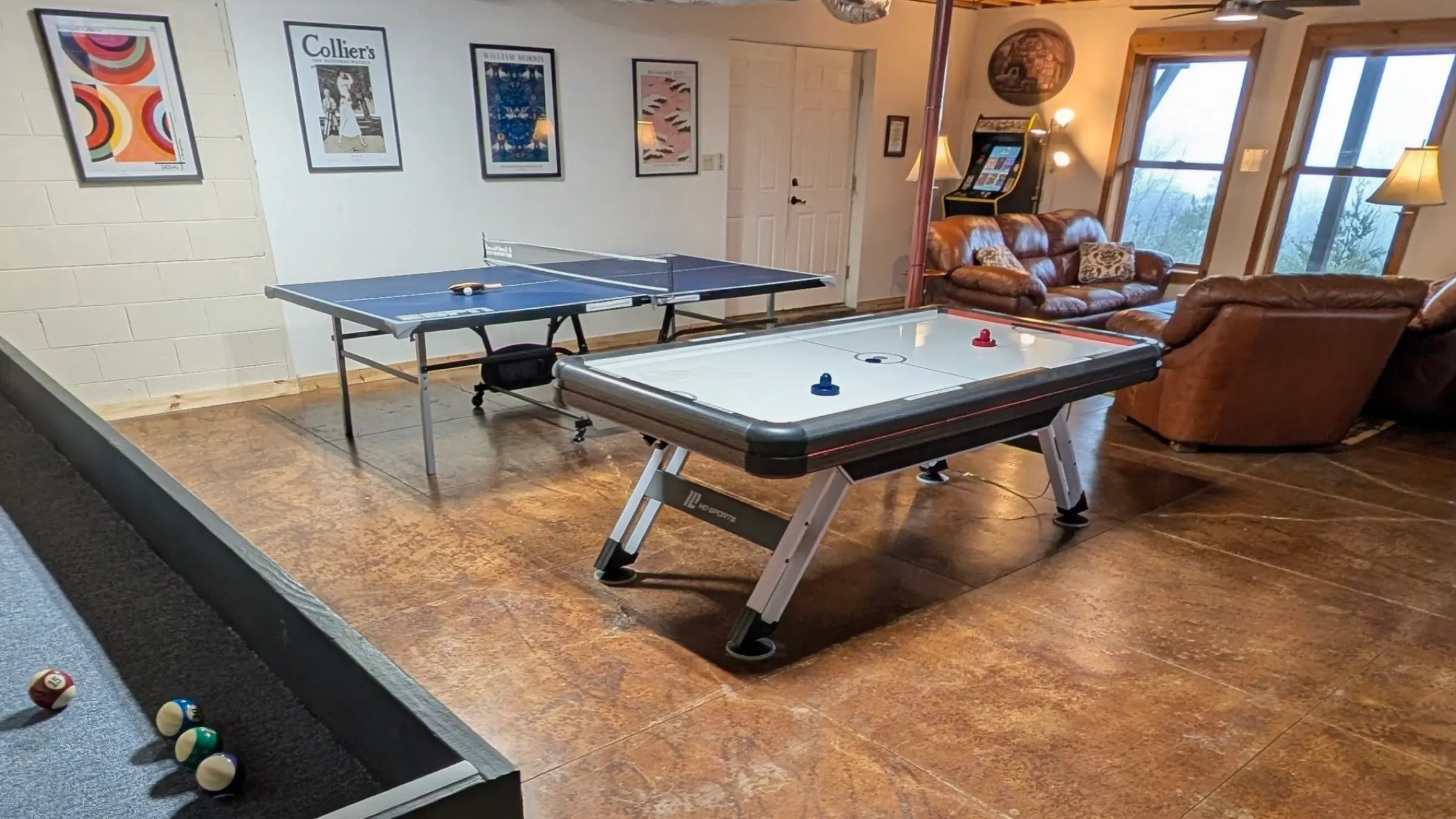 Basement game room with arcade and ping pong
