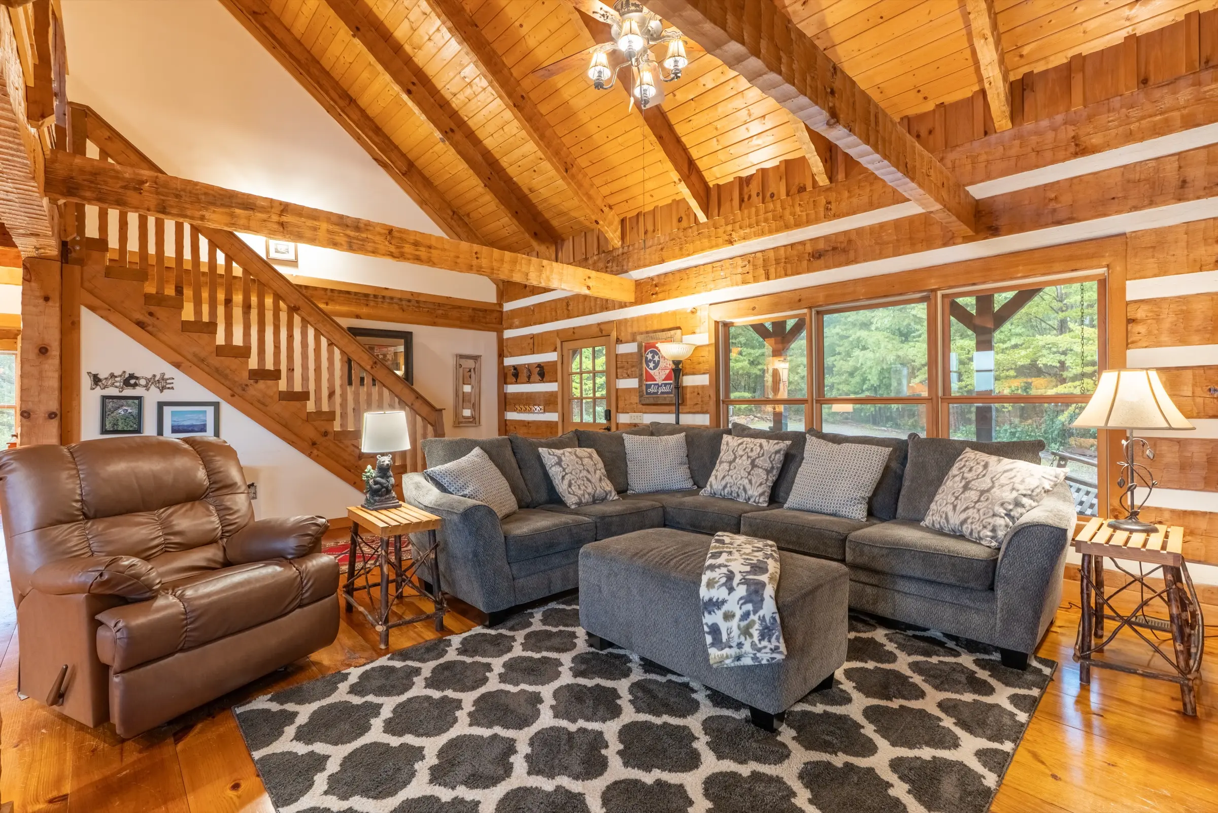 Great room with stone fireplace and electric log insert