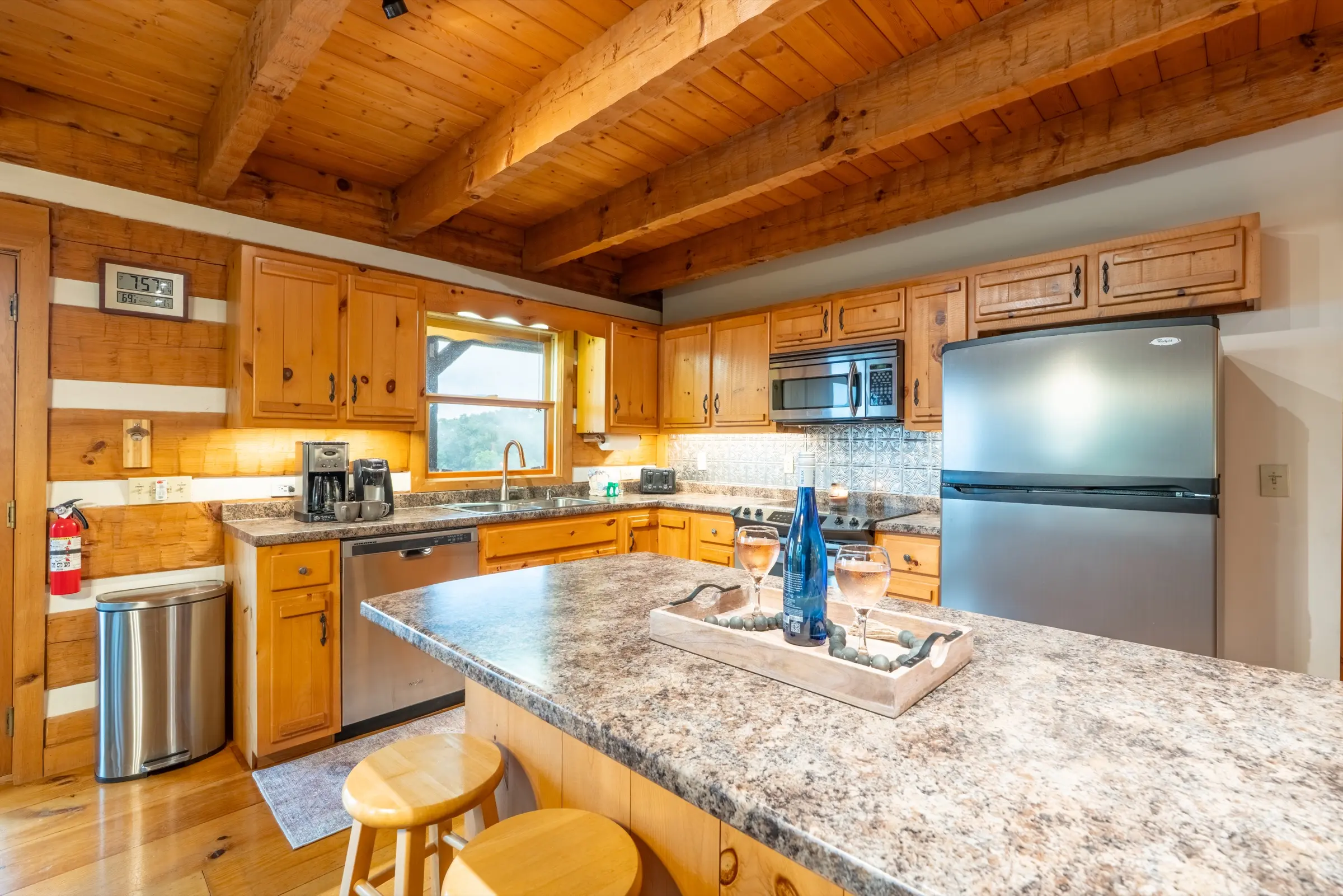 Full kitchen with island, Keurig, and stainless appliances